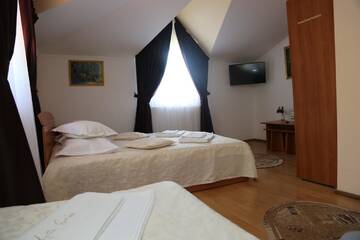 Фото номера Трехместный номер Гостевой дом New Aosta Garden г. Синая 4